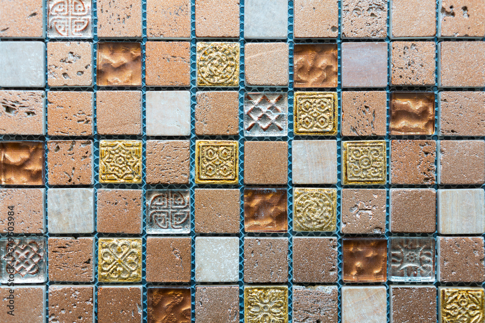 Ceramic mosaic tiles with white and brown embossed squares to decorate the kitchen, bathroom or pool. Mosaic of brown marble in the form of squares