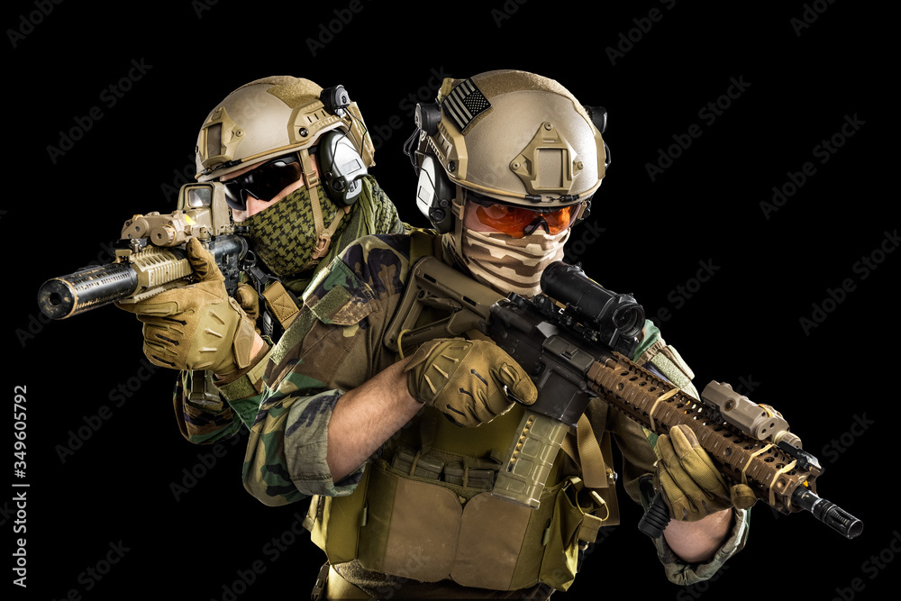 Male in uniform of Tactical Units of Police with submachine gun P90. Shot in studio. Isolated with clipping path on black background