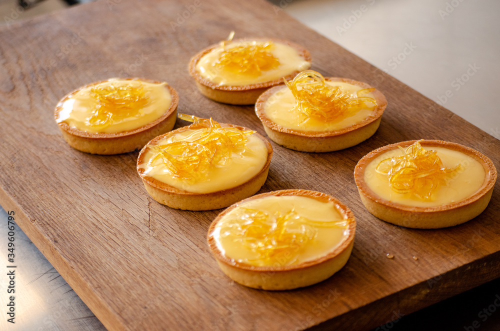 lemon tart on a wooden cutting board