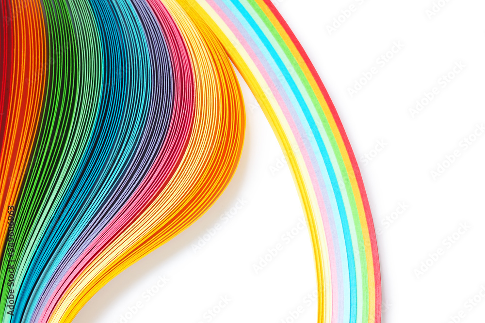 Strips of paper for quilling on white background, rainbow color Strips of paper for quilling on white background, rainbow color