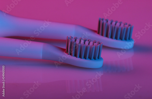 Toothbrush head with pink blue gradient neon light