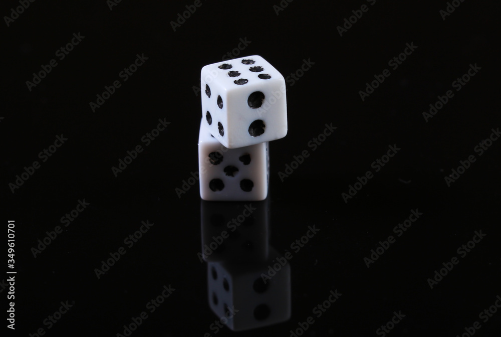 Two dice on a black background with reflection Two dice on a black background with reflection