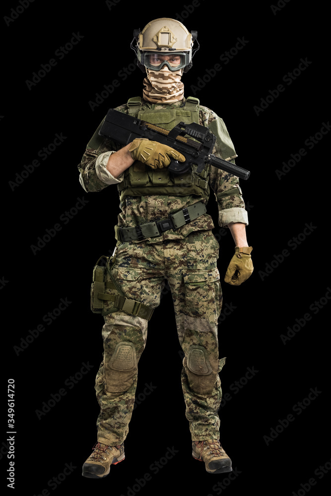 US marine corps soldier with weapon. Shot in studio. isolated with clipping on black background. US marine corps soldier with weapon. Shot in studio. isolated with clipping on black background.