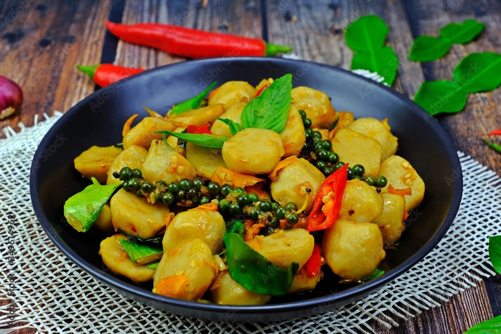 Spicy stir fried fish ball with yellow chillies. Spicy stir fried fish ball with yellow chillies.