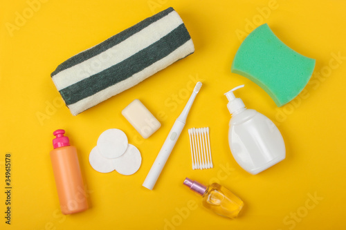 Beauty, health care, cosmetics, hygiene product on yellow background. Flat lay. Top view