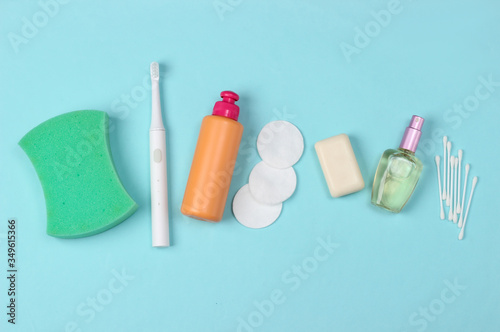 Beauty, health care, cosmetics, hygiene product on blue background. Flat lay. Top view