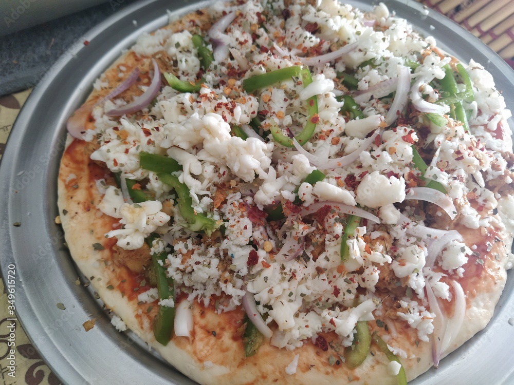 Close up of pizza before baking Close up of pizza before baking