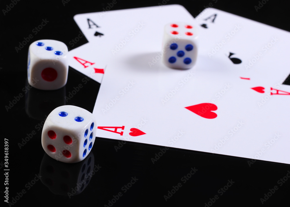 Dice with four aces on a black background. Dice with four aces on a black background.