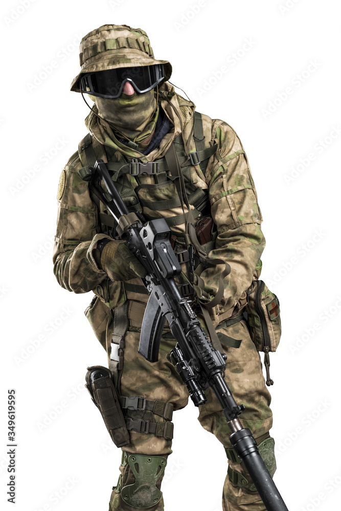 Special forces soldier with rifle. Shot in studio. Isolated with clipping path on white background.
