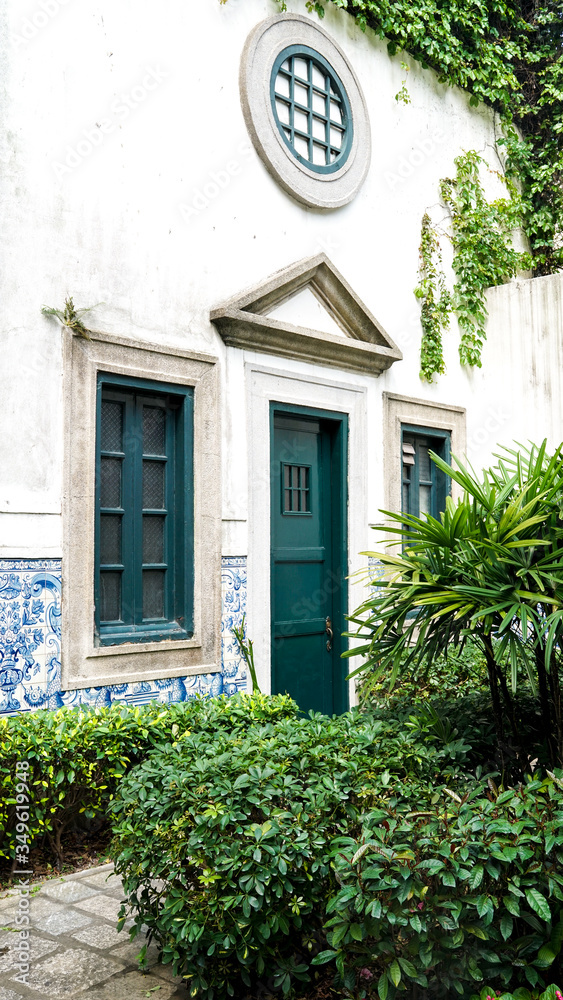 old house with green ivy, heritage building in Macau, Portuguese colonial architecture