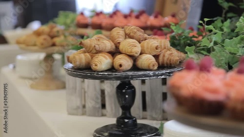 Plate with croissants on the showcase  at the stand up buffet.