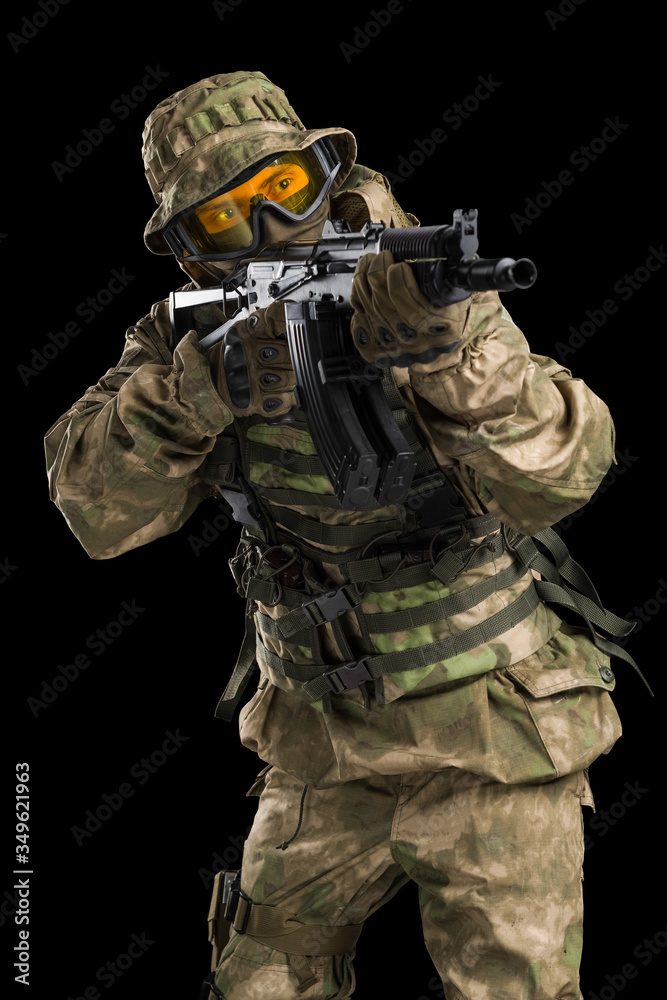 Special forces soldier with rifle. Shot in studio. Isolated with clipping path on black background. Special forces soldier with rifle. Shot in studio. Isolated with clipping path on black background.