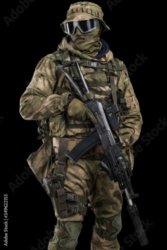 Special forces soldier with rifle. Shot in studio. Isolated with clipping path on black background.