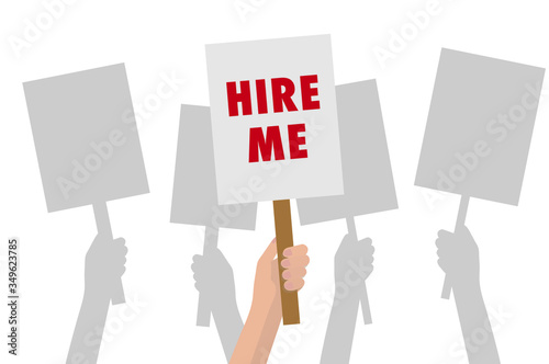 Hand holding 'HIRE ME' sign