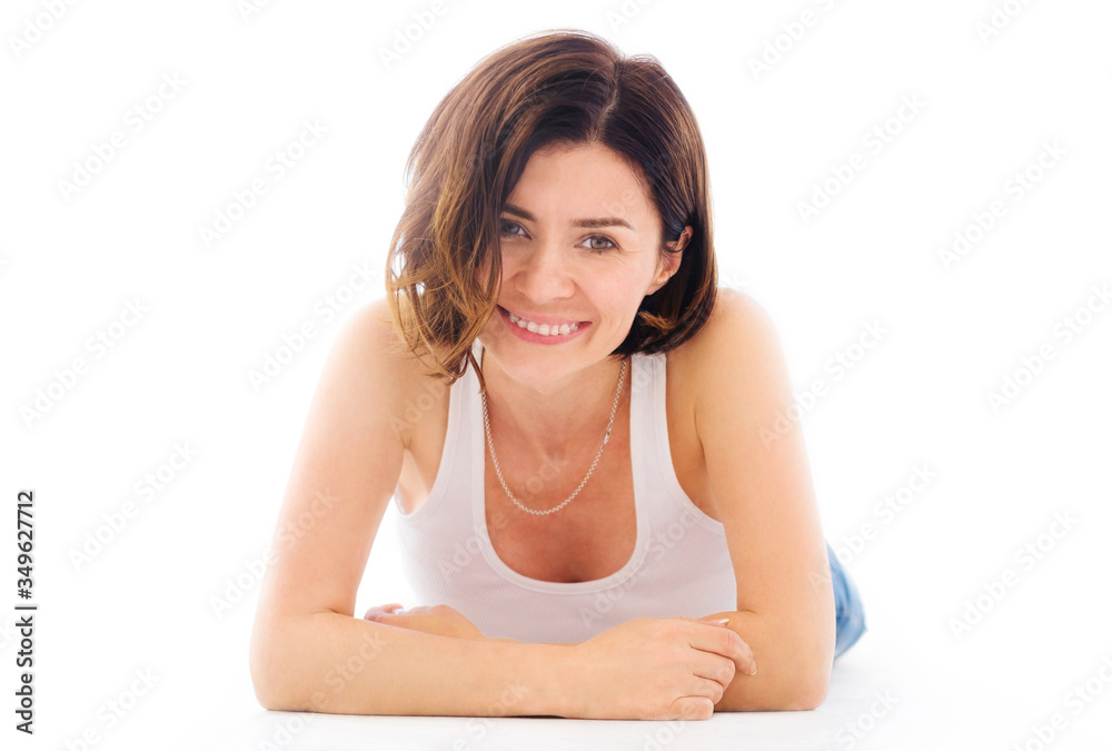 Beautiful girl lying on a floor isolated on a white background Beautiful girl lying on a floor isolated on a white background