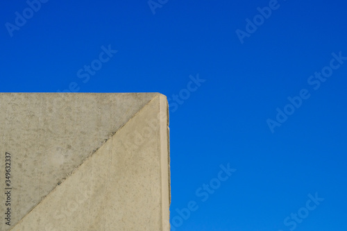 precast concrete panels, concrete footing with blue sky in background
