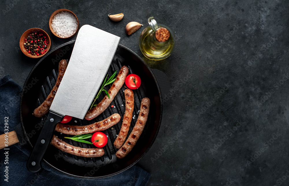 grilled sausages with tomatoes and
rosemary in
pan on a stone background with copy space for your text grilled sausages with tomatoes and
rosemary in
pan on a stone background with copy space for your text