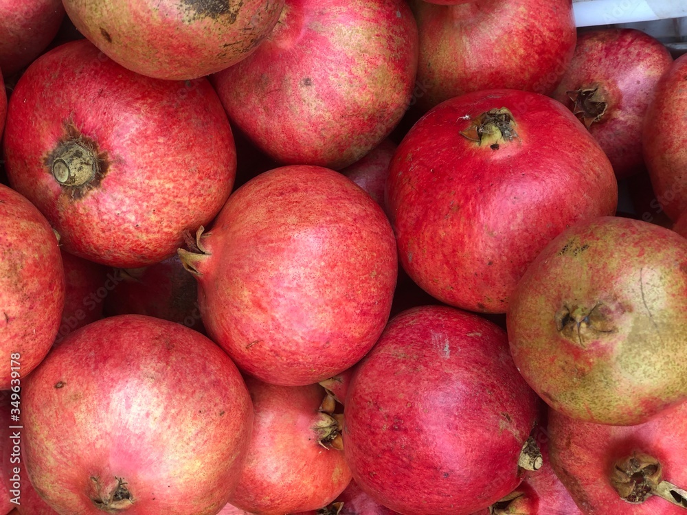 Fresh pomegranate fruit in market.Healthy food concept.Full frame Fresh pomegranate fruit in market.Healthy food concept.Full frame