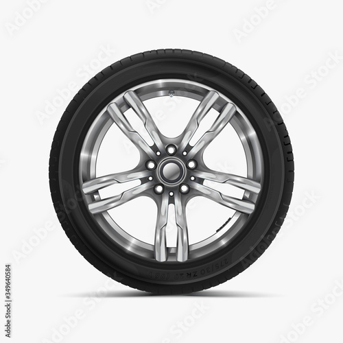 Front view of car wheel isolated on white. Modern car wheel on light alloy disc. Car tire Illustration. Automotive wheel with soft shadow. © Strajinsky
