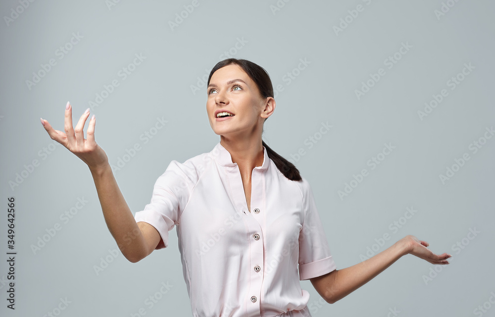 happy girl on a white background with raised hands happy girl on a white background with raised hands