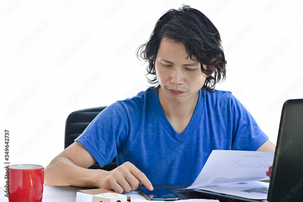 Business man calculating on calculator app on smartphone wear casual clothes working with computer and business strategy diagram at home office desk and coffee cup when working from home
