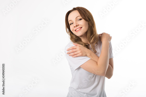 beautiful young woman in a white t-shirt on a white background 