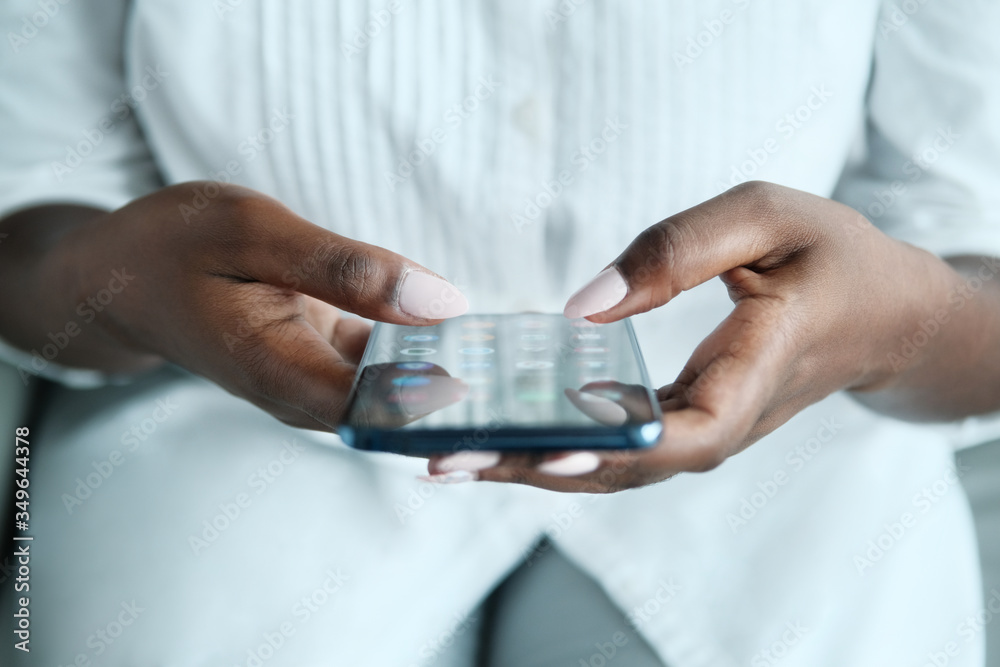 Black Woman Searching Application On Smartphone