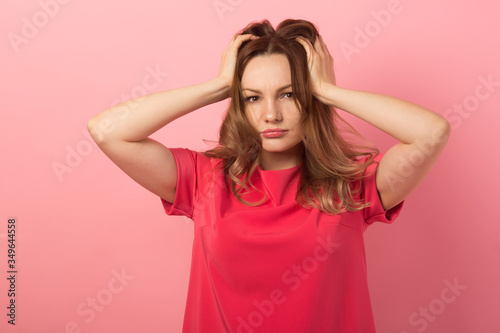 beautiful young woman with make-up on pink background