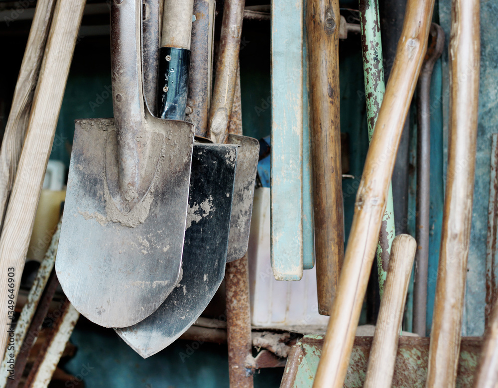 dirty garden work tools shovels soiled in the ground in vintage style dirty garden work tools shovels soiled in the ground in vintage style