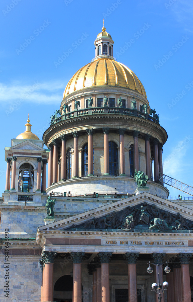 Colonnade and golden dome of Saint Isaac's Cathedral in St Petersburg, Russia. Historic old church details, close up architecture view 