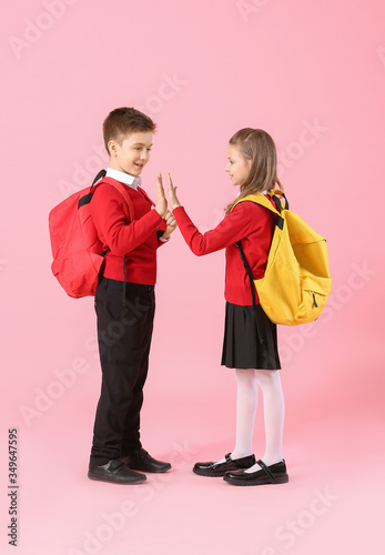 Cute little pupils giving e...