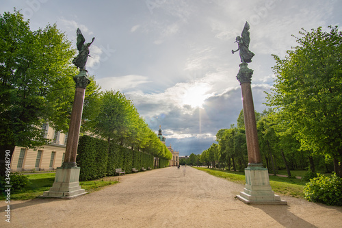 Beautiful Angel Statues at Schlosspark in Berlin at seperated sky in the sun photo