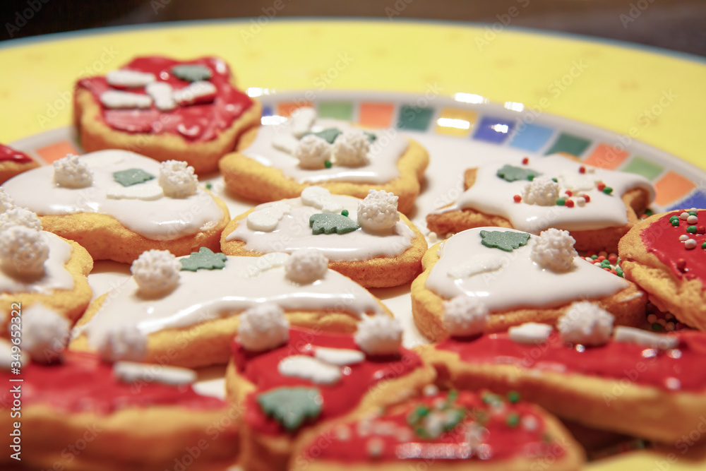 A close up of a plate of colorful Christmas cookies