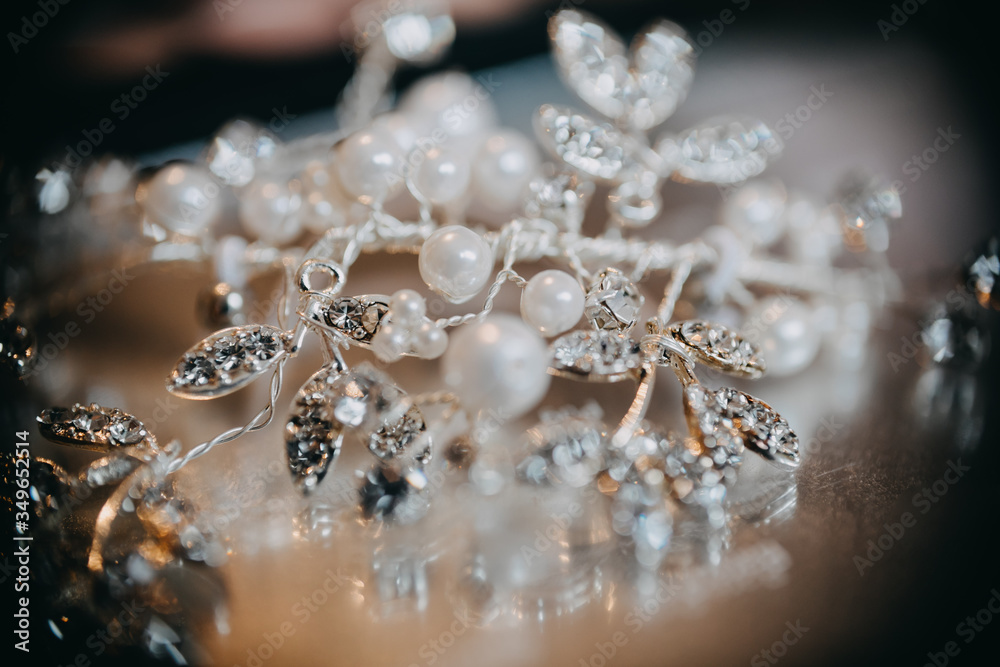photo of a bride's hair accessory on a table photo of a bride's hair accessory on a table