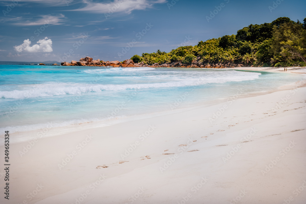 Beautiful anse cocos beach on sunny day at la digue island in Seychelles
