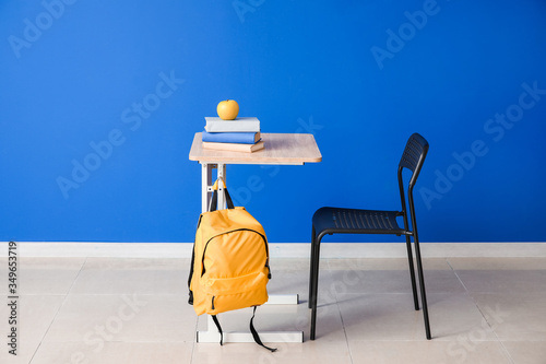 Modern school desk near col...