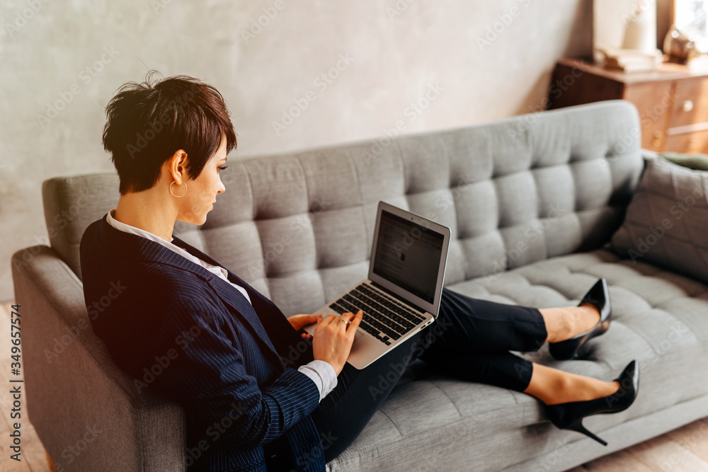 Portrait of young beautiful smiling business woman with laptop - working from home Portrait of young beautiful smiling business woman with laptop - working from home