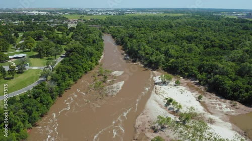 Oklahoma City, Oklahoma, USA. Aerial: water flowing down North Canadian River at the Overholser Dam on Lake Overholser photo