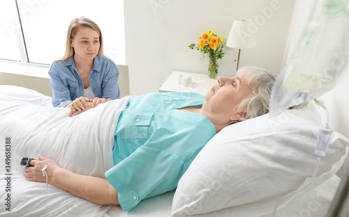 Young woman visiting her gr...