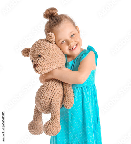 Little girl with toy on whi...