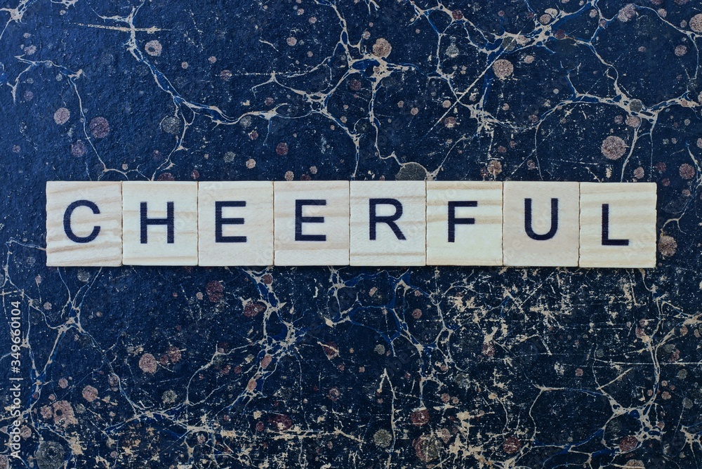 Obraz premium text the word cheerful from gray wooden small letters with black font