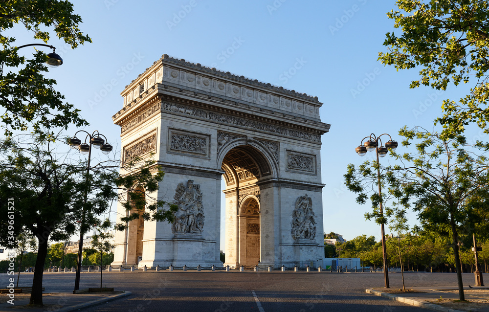 The famous Triumphal Arch at sunny day , Paris, France.