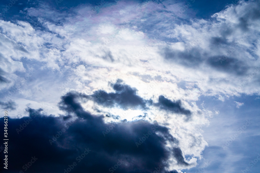 Bright contrasting blue sky with white fluffy clouds
