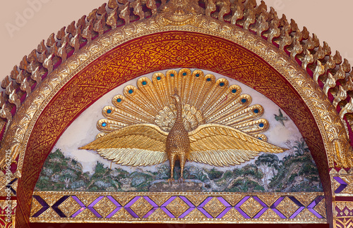 Sacred peakock - exterior detail of Vihara at Wat Phra That Doi Suthep in Chiang Mai, Thailand. In buddhism, Peacocks are associated with openness and purity. photo