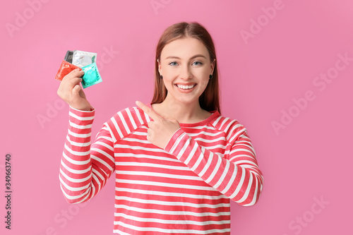 Young woman with condoms on...