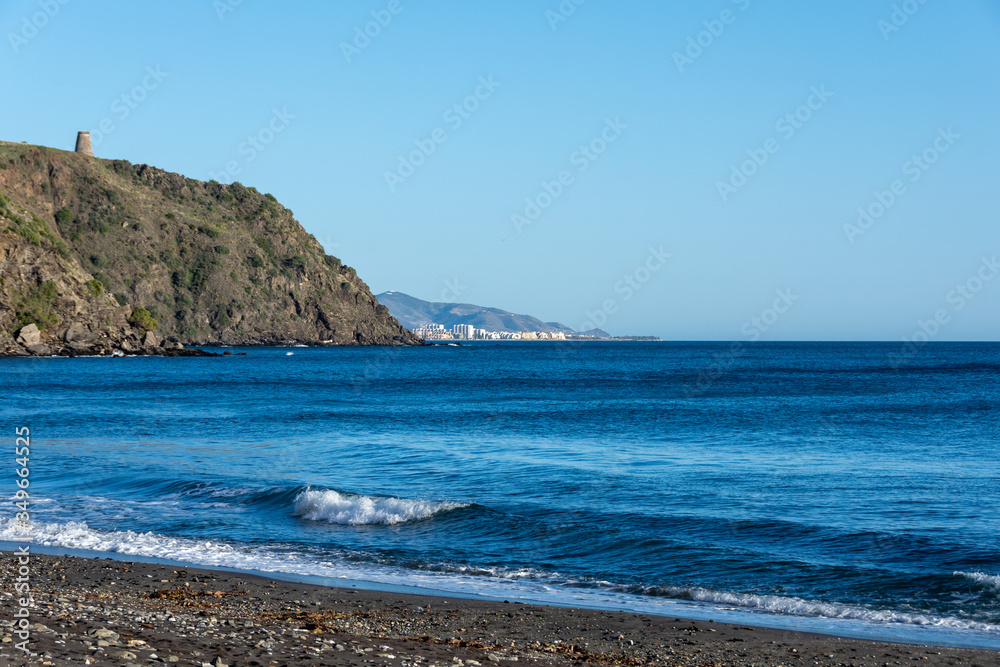 Torreón de Velilla on the hill in the Granada coastal town of Almuñécar with the deep blue Mediterranean sea in the background Torreón de Velilla on the hill in the Granada coastal town of Almuñécar with the deep blue Mediterranean sea in the background
