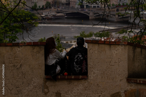 
siluleta of a couple sitting on a castle photo