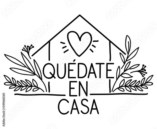 Quedate en casa text with house heart and leaves vector design photo