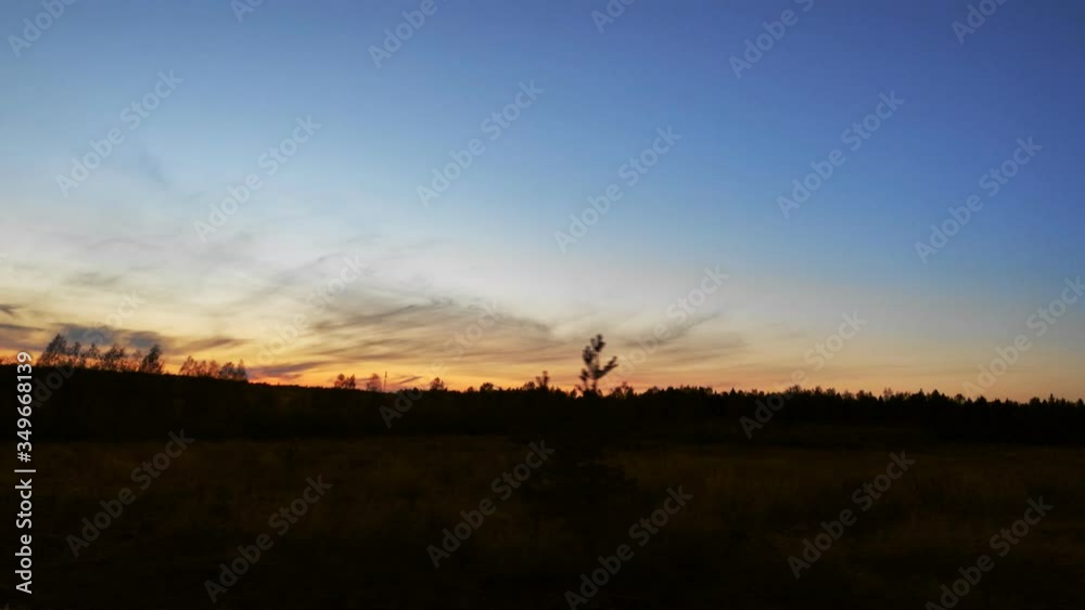 Sunset and twilight next to the forest. Shot in motion. Sunset and twilight next to the forest. Shot in motion.