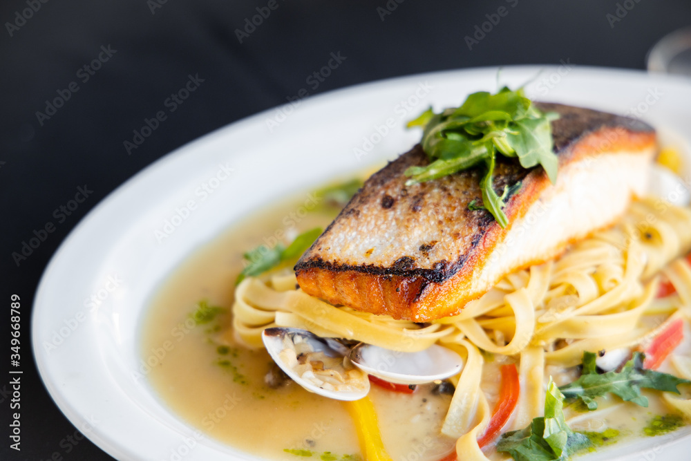 Grilled Salmon Steak and Seafood Pasta